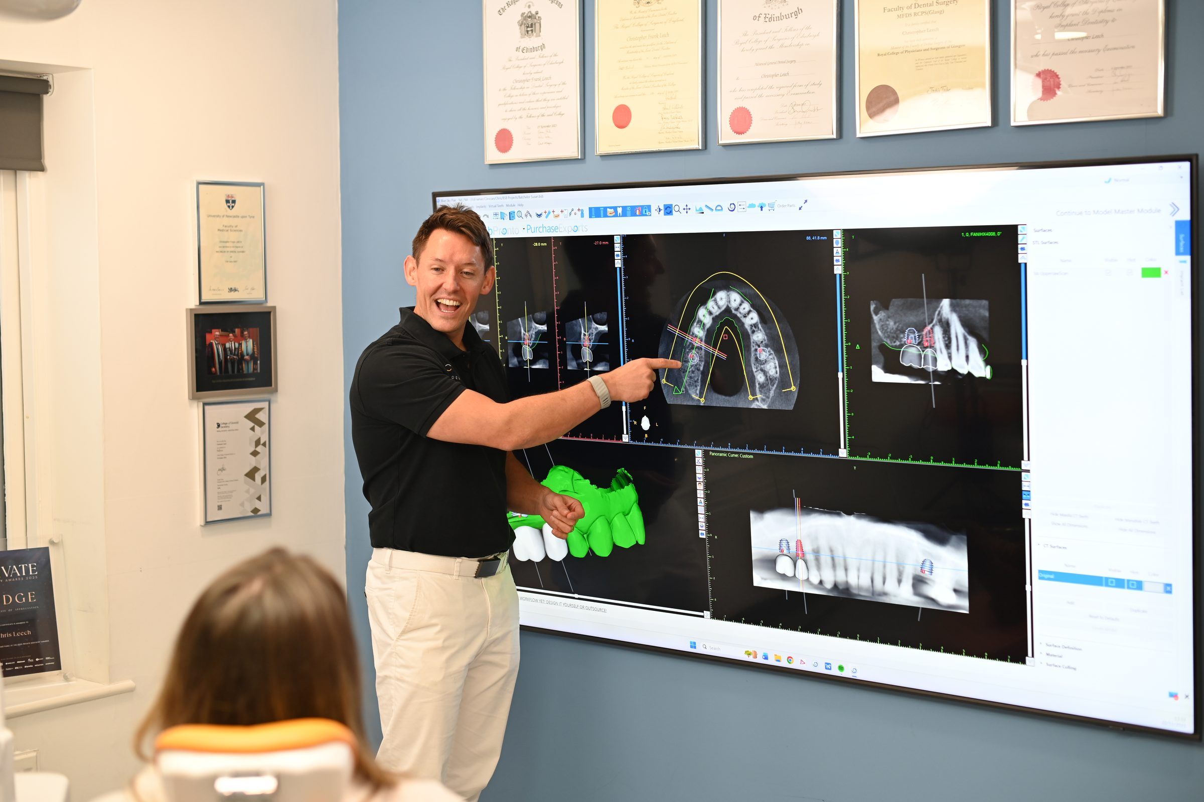 Dr Chris Leech explaining an implant plan on screen