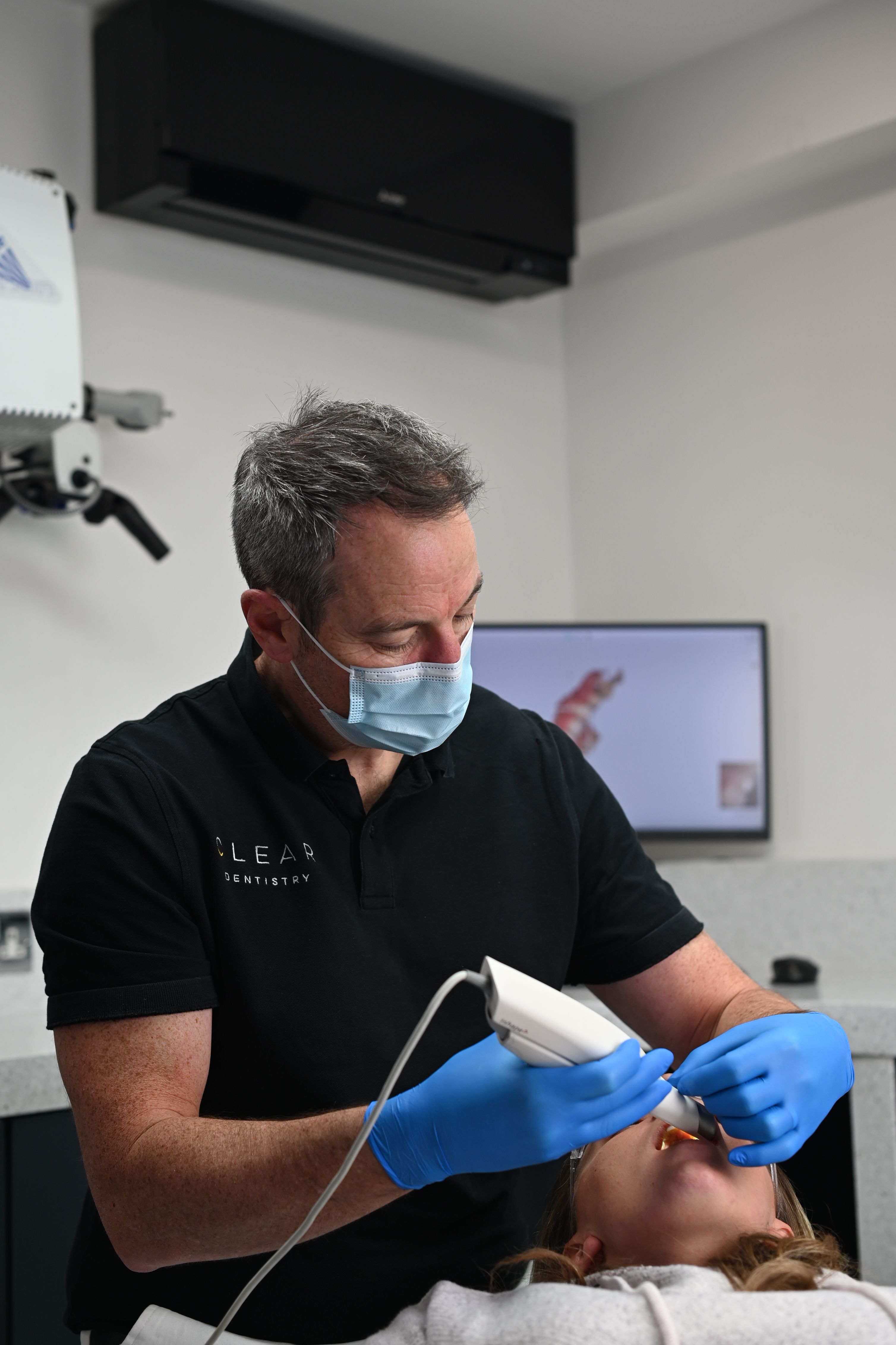 Dr Christopher Leech treating a patient